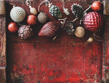 Close-up of pine cone on wooden door