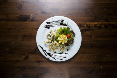 High angle view of fruit salad in plate on table