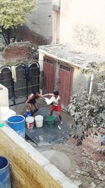 High angle view of people working on building