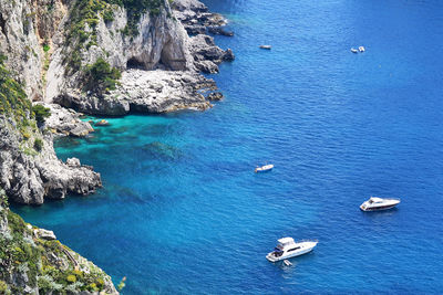 High angle view of boats sailing in sea against sky