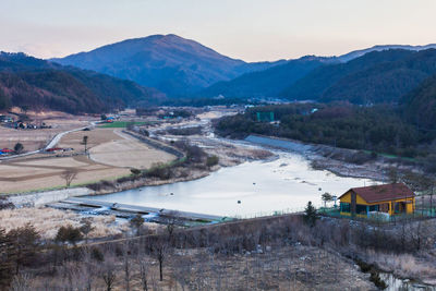 High angle view of houses and mountains against sky