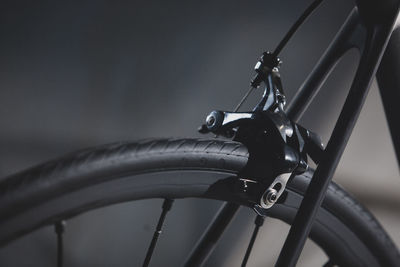 Close-up of bicycle wheel against black background