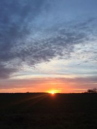 Scenic view of landscape at sunset