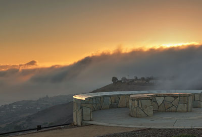 Scenic view of mountains against sky at sunset