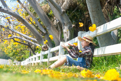 Man holding flowering plants