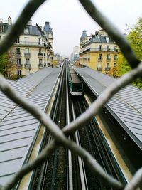 Close-up of chainlink fence against sky