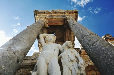 Low angle view of statue against sky