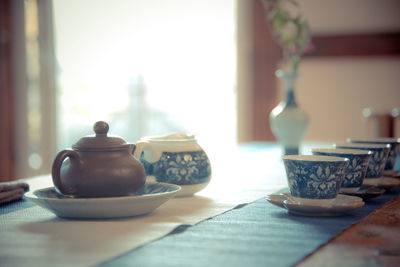 Close-up of tea cup on table at home