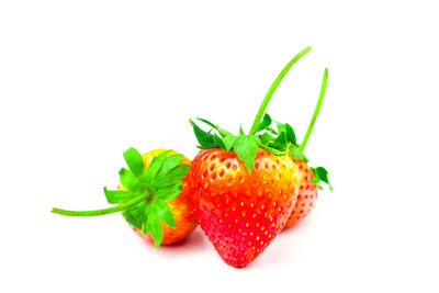 Close-up of strawberry over white background
