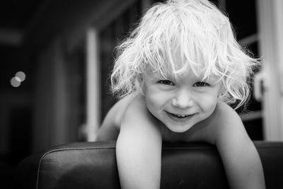 Portrait of cute girl sitting at home