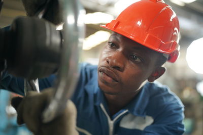 Close-up of man working in factory