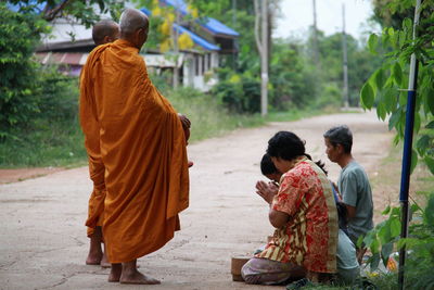 Rear view of friends at temple