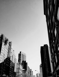 Low angle view of skyscrapers against clear sky