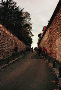 People walking on road in city