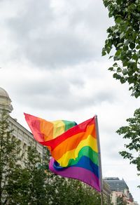 Low angle view of flags against sky