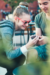 Young woman using mobile phone