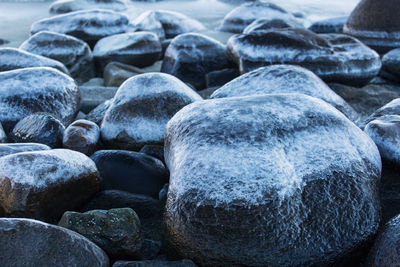 Close-up of stones on water