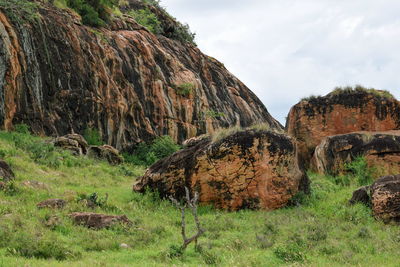 Rock formations on landscape against sky, tsavo east national park, kenya 