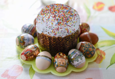 Close-up of sweet food with easter eggs on table