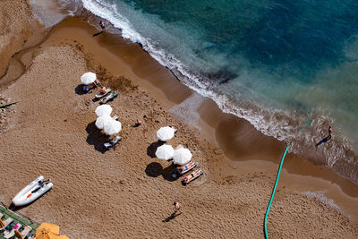 Aerial view of people relaxing on beach