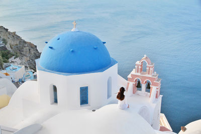 High angle view of people outside building by sea