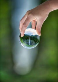 Close-up of hand holding glass