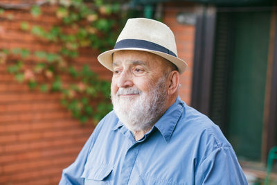 Portrait of man wearing hat outdoors