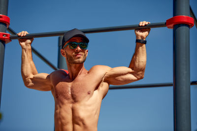 Low angle view of man standing against sky