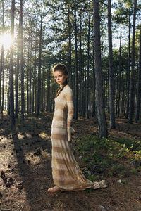 Beautiful young woman in forest