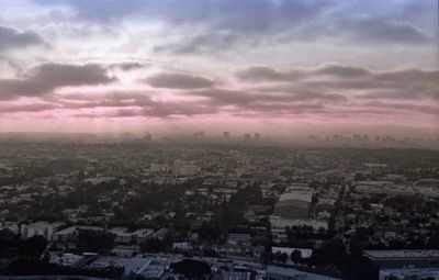 High angle view of cityscape against cloudy sky