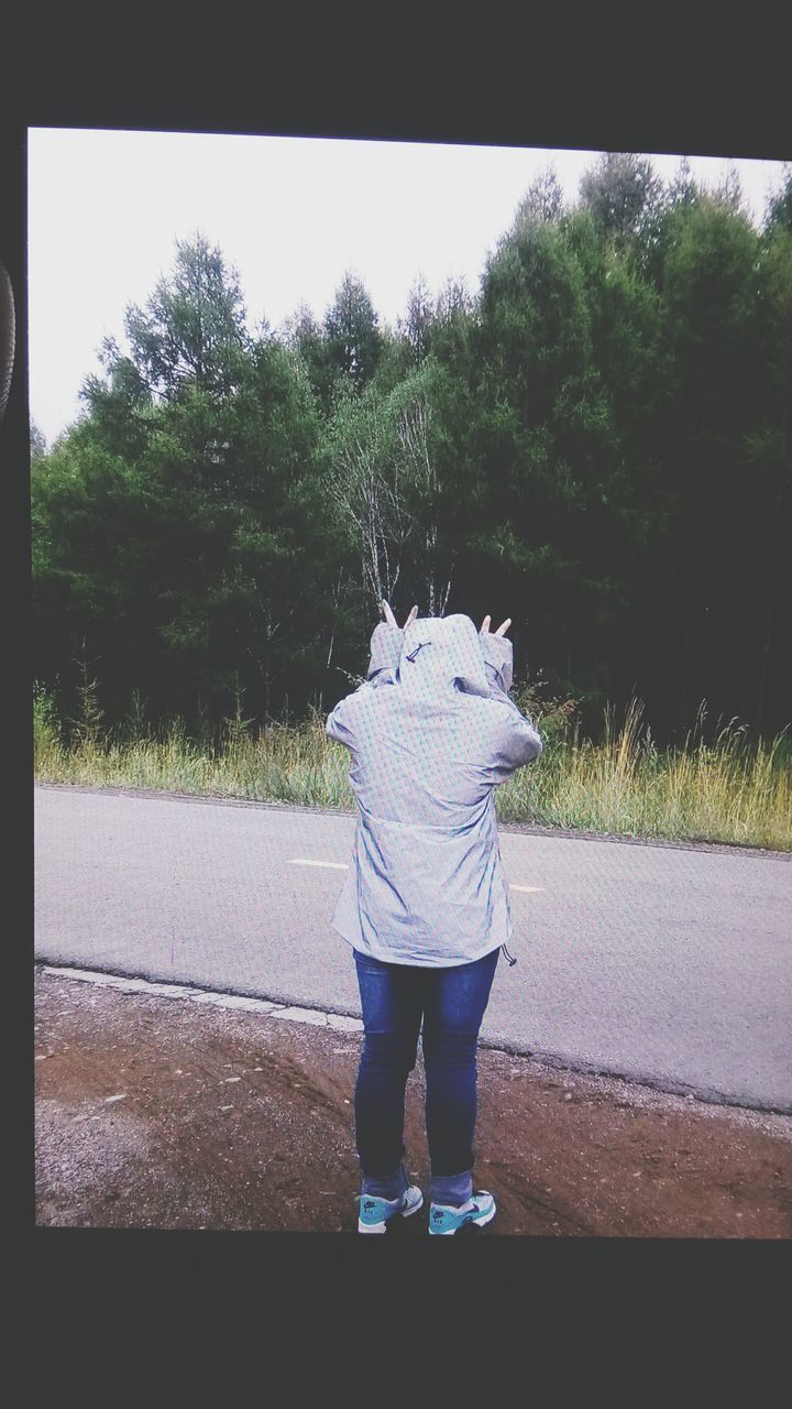 transfer print, tree, full length, auto post production filter, standing, rear view, casual clothing, lifestyles, leisure activity, childhood, day, outdoors, growth, plant, nature, green color, park - man made space, blue