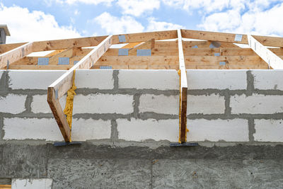 Roof trusses not covered with ceramic tiles on a single-family house under construction. 