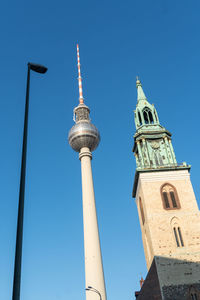 Berlin television tower with saint mary church marienkirche bell tower