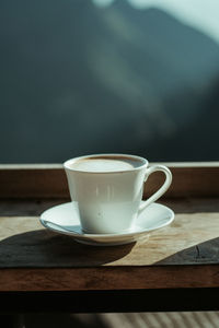 Close-up of coffee cup on table