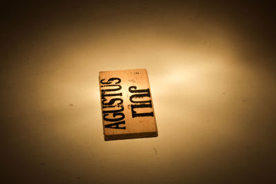 Information sign on table against wall