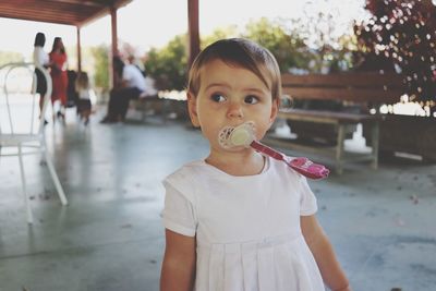 Portrait of girl standing outdoors