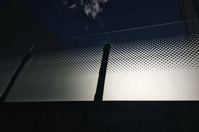 Low angle view of silhouette window against sky at night