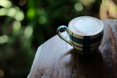 Close-up of coffee cup on table