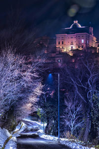 Illuminated buildings in city at night