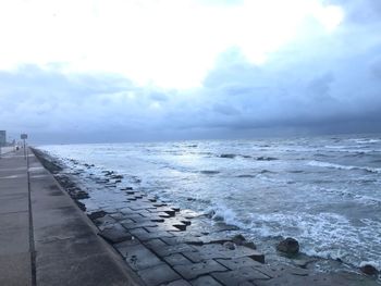 Scenic view of sea against sky during winter