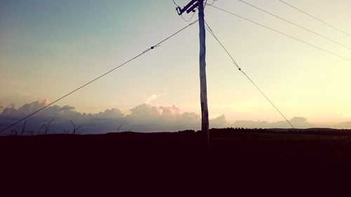 Silhouette trees against sky during sunset