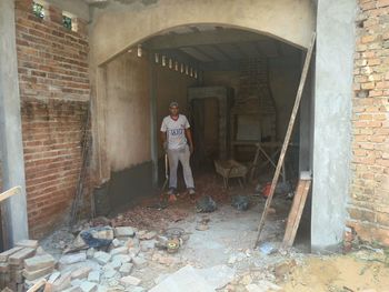 Full length of man standing in abandoned building