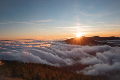 Photo shoot of sunset on lysa hora with a view of smrk mountain in beskydy mountains. clouds flow