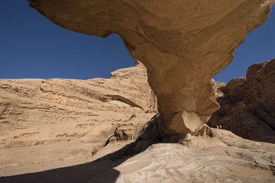 Rock formation in desert against clear sky