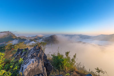 Scenic view of mountains against clear blue sky