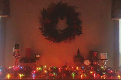 Illuminated christmas tree against sky at night