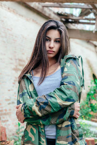 Close-up portrait of young woman standing outdoors