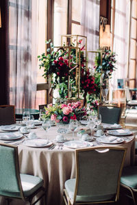 Empty chairs and tables in restaurant