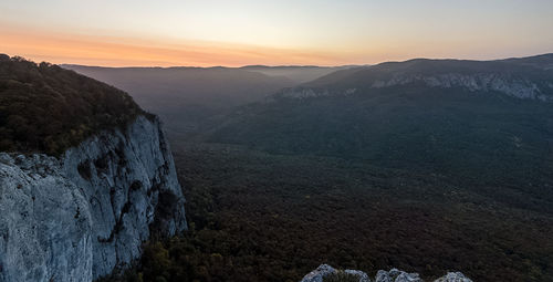 Scenic view of mountains against sky during sunset