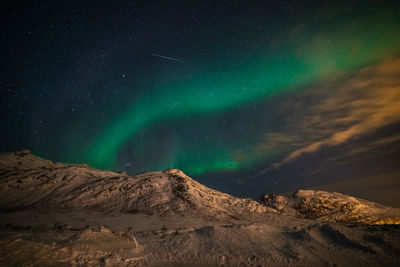 Low angle view of mountain against sky at night